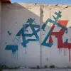 Школу в Бад-Арользене осквернили граффити с палестинской и советской символикой